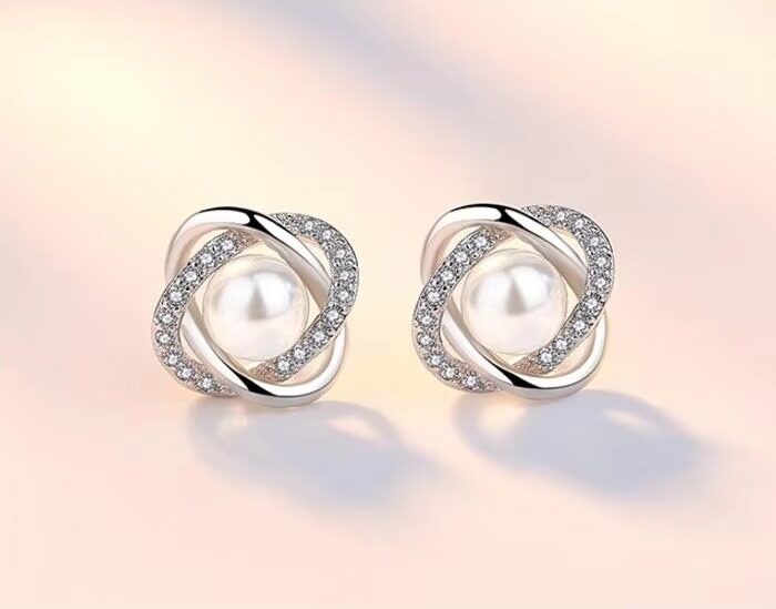 Elegant Pearl and Diamond Stud Earrings - Luxurious Twisted Design